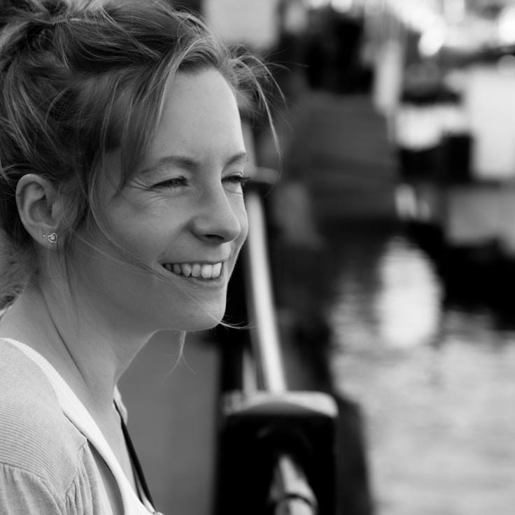 Ariana Shah, Lead Design Curator at Garden Quiet Vector, reviewing corporate floral arrangements